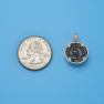 Pendant size next to a Quarter
