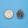 Pendant size next to a Quarter