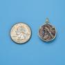 Pendant size next to a Quarter