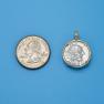 Pendant size next to a Quarter