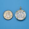 Pendant size next to a Quarter
