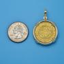 Pendant size next to a Quarter