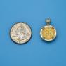 Pendant size next to a Quarter