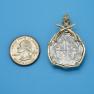 Pendant size next to a Quarter