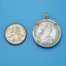 Pendant size next to a Quarter