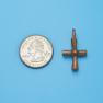 Cross size next to a Quarter