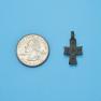 Cross size next to a Quarter