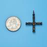 Cross size next to a Quarter