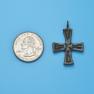 Cross size next to a Quarter