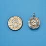 Pendant size next to a Quarter