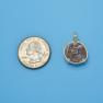 Pendant size next to a Quarter
