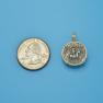 Pendant size next to a Quarter