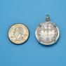 Pendant size next to a Quarter
