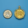 Pendant size next to a Quarter