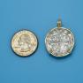 Pendant size next to a Quarter