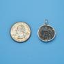 Pendant size next to a Quarter