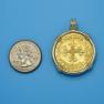Pendant size next to a Quarter