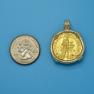 Pendant size next to a Quarter