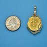 Pendant size next to a Quarter