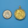 Pendant size next to a Quarter