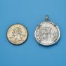 Pendant size next to a Quarter