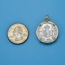Pendant size next to a Quarter