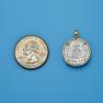 Pendant size next to a Quarter