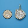 Pendant size next to a Quarter