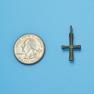 Cross size next to a Quarter