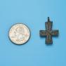 Cross size next to a Quarter