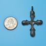 Cross size next to a Quarter