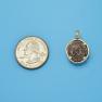 Pendant size next to a Quarter