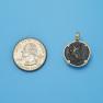 Pendant size next to a Quarter