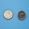 Pendant size next to a Quarter
