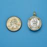 Pendant size next to a Quarter