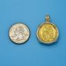 Pendant size next to a Quarter