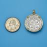 Pendant size next to a Quarter