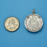 Pendant size next to a Quarter
