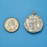 Pendant size next to a Quarter