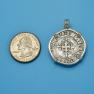 Pendant size next to a Quarter