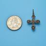 Cross size next to a Quarter