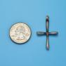 Cross size next to a Quarter
