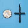 Cross size next to a Quarter