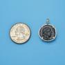 Pendant size next to a Quarter