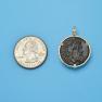 Pendant size next to a Quarter