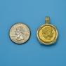 Pendant size next to a Quarter