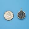 Pendant size next to a Quarter
