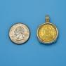 Pendant size next to a Quarter