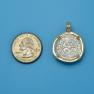 Pendant size next to a Quarter