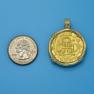Pendant size next to a Quarter